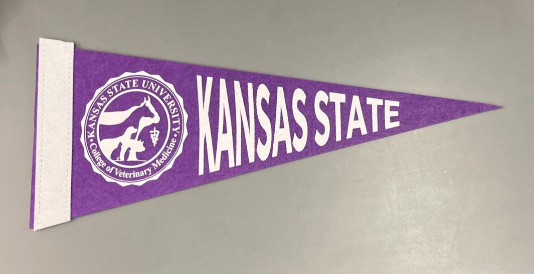 Purple pennant with 'Kansas State' text and CVM seal on a gray background.