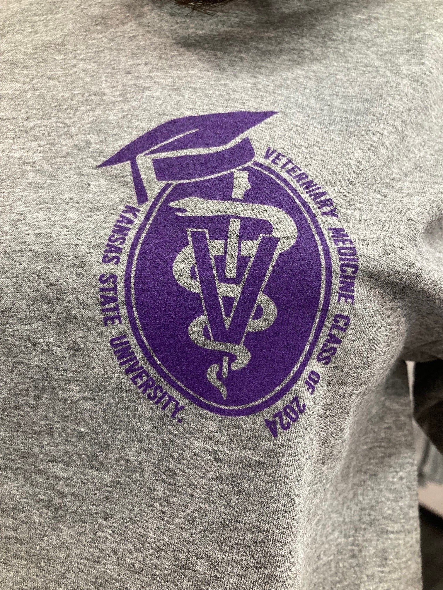 A close-up view of the purple graduation seal. 