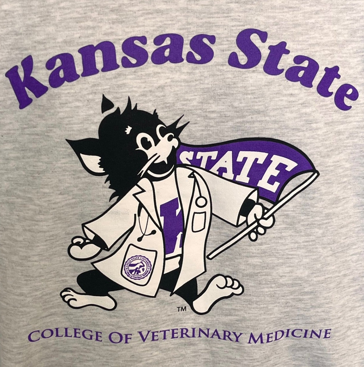 Gray sweatshirt with Kansas State College of Veterinary Medicine text and a purple Labcoat Willie graphic in the center.  