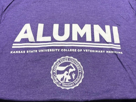 A close-up view of the white "Alumni Kansas State University College of Veterinary Medicine" text and white CVM seal. 