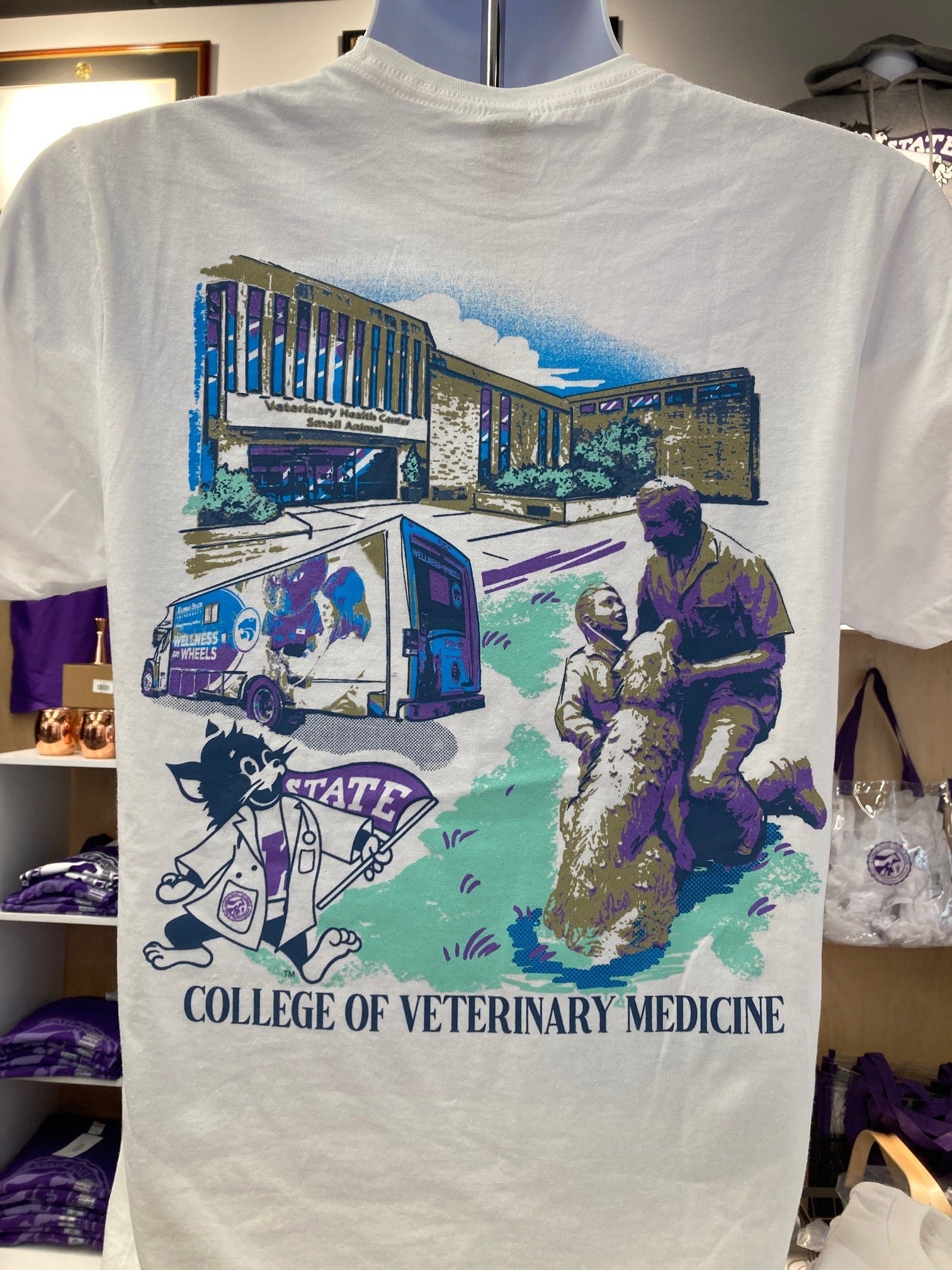 A white Gildan t-shirt with full color back print featuring the College of Veterinary Medicine, including a statue and a Labcoat Willie illustration with the words "College of Veterinary Medicine". 