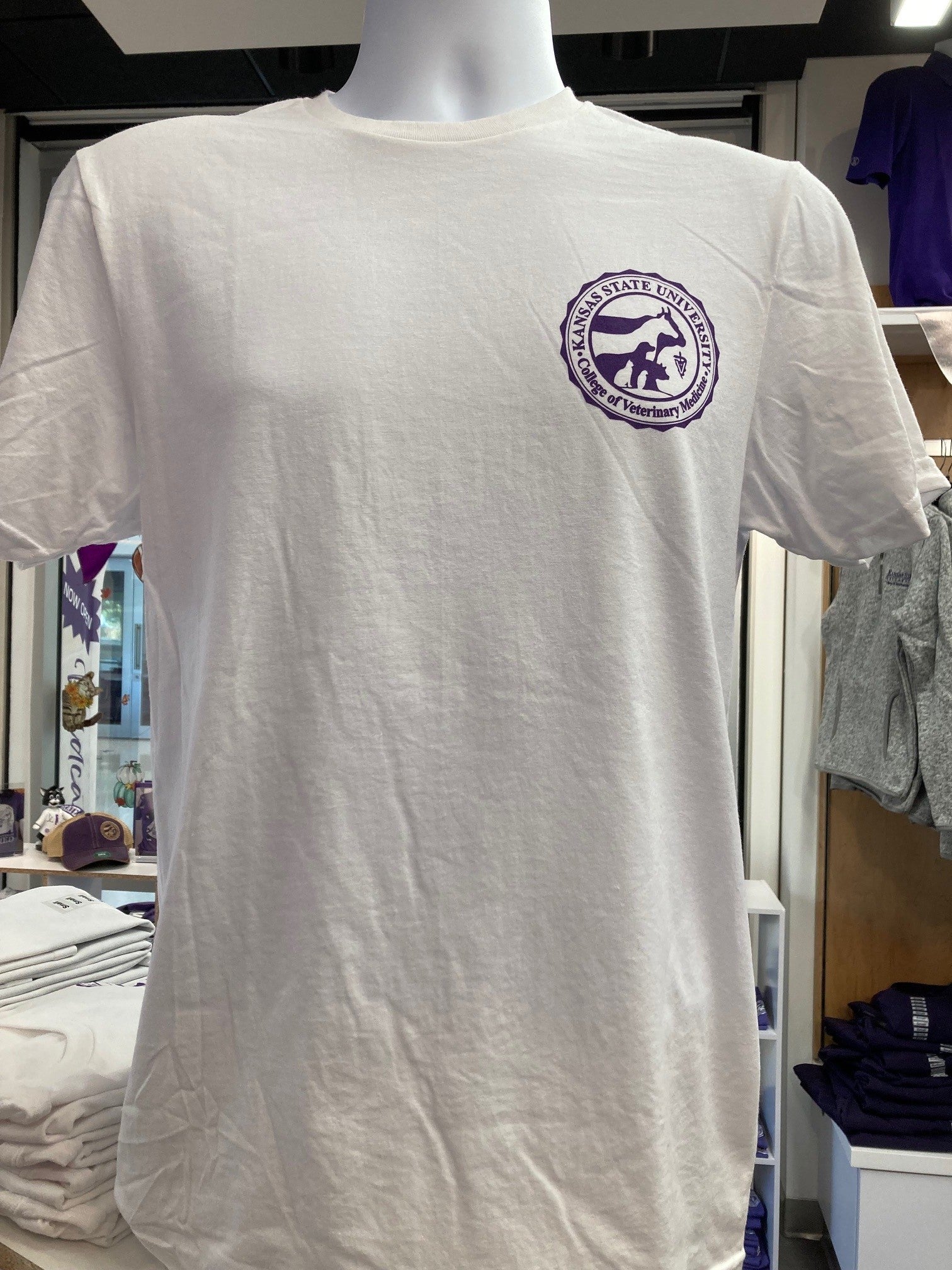 A front view of the Gildan t-shirt that features a purple CVM seal on the upper left chest. 