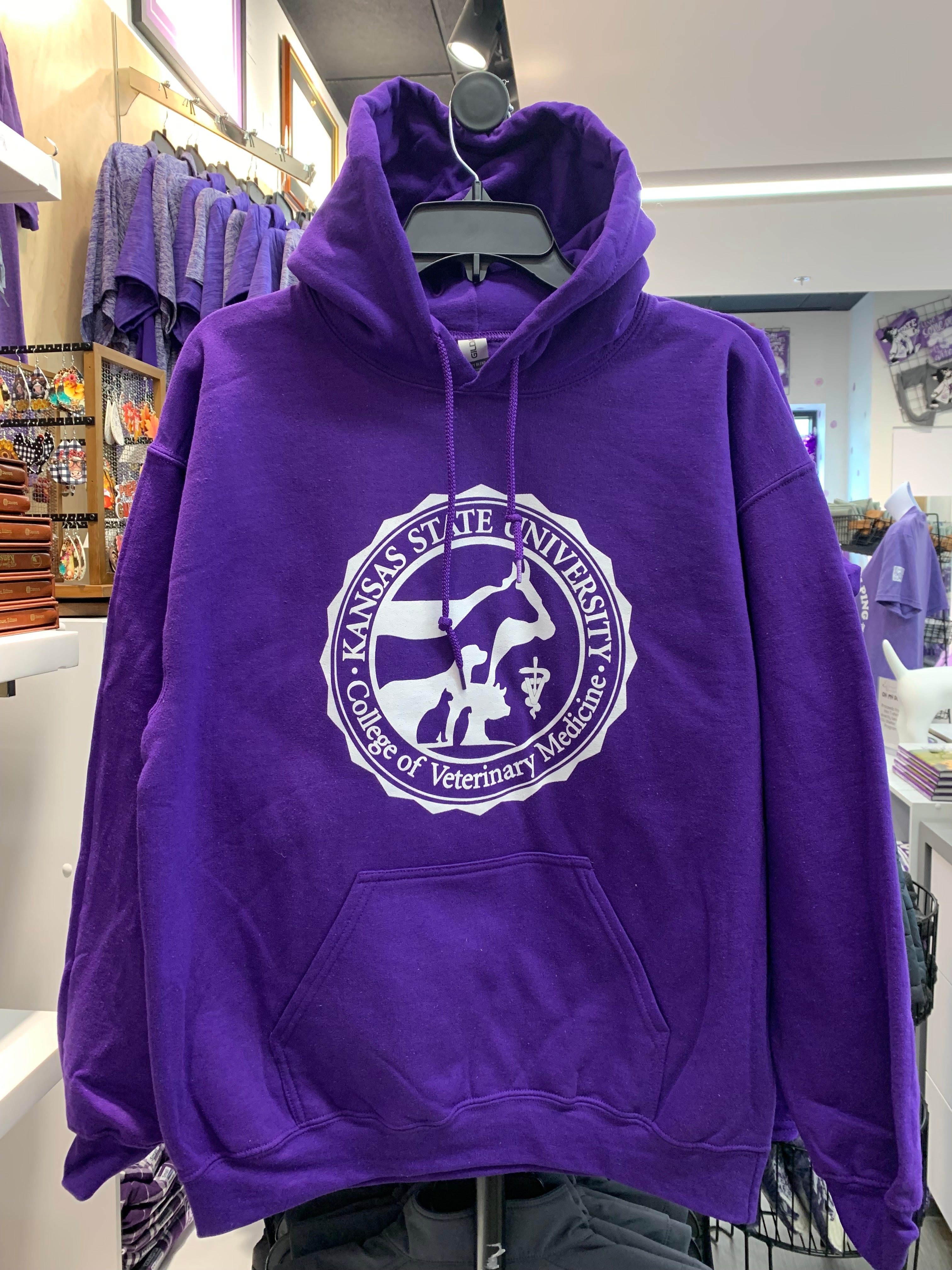 A purple Gildan pullover hoodie with a white CVM seal printed on the front.