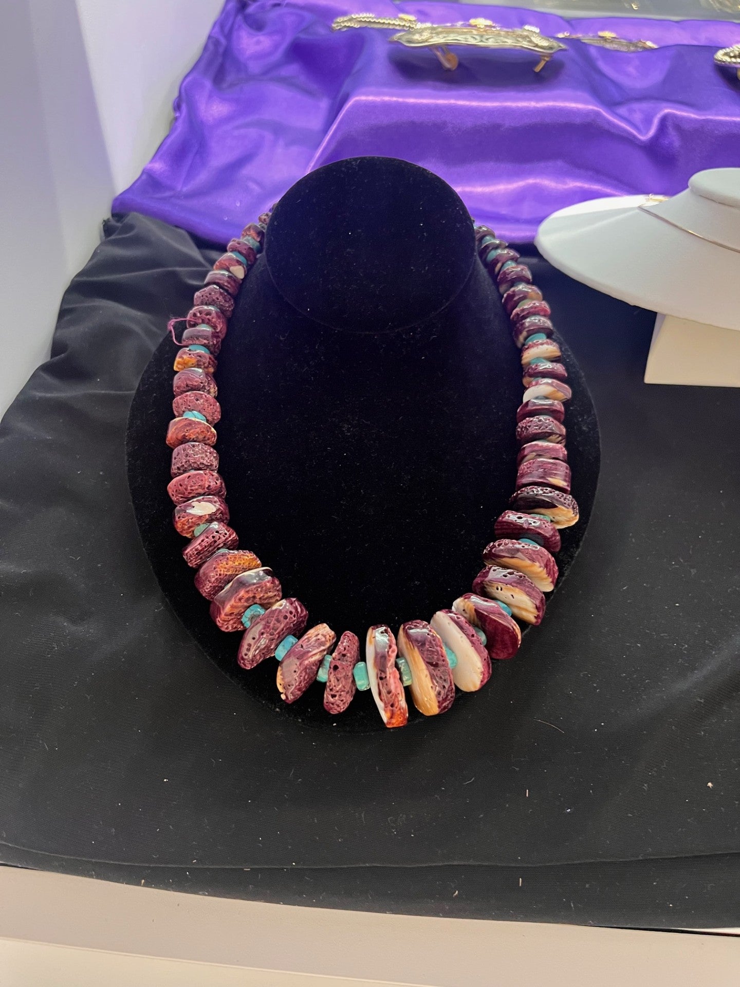Colorful alternating pink/purple oyster shell and blue turquoise necklace. 