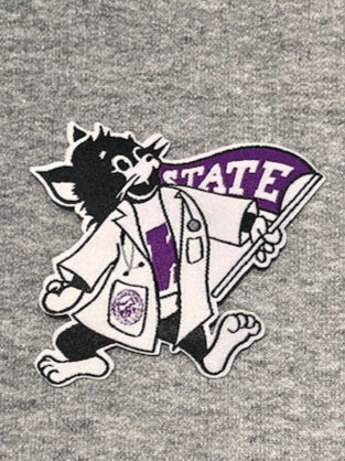 A logo iron-on patch of Labcoat Willie on a gray background. 