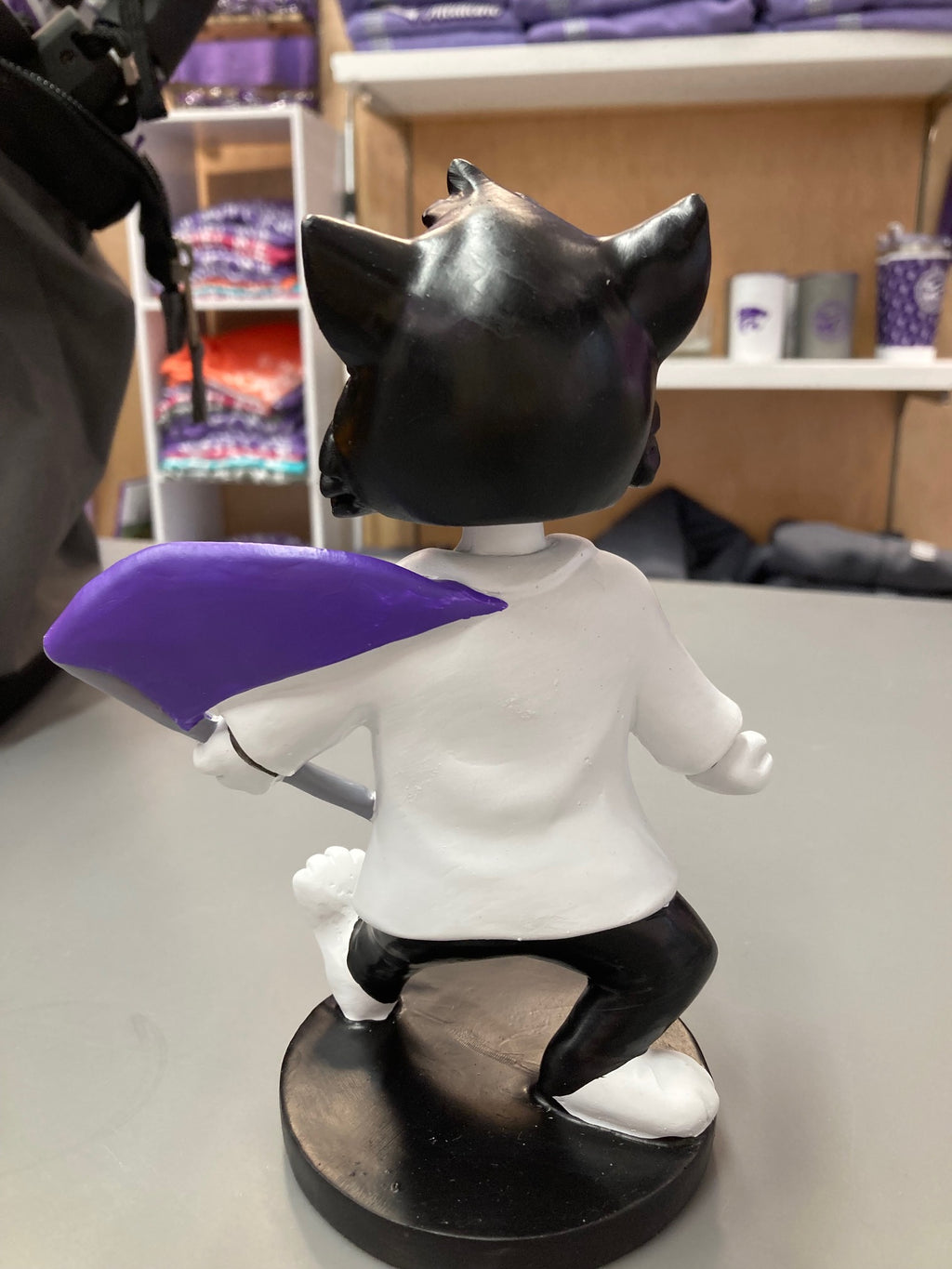 A customized Labcoat Willie Bobble Head wearing a white lab coat with a 'STATE' flag element, seated on a bobblehead base.