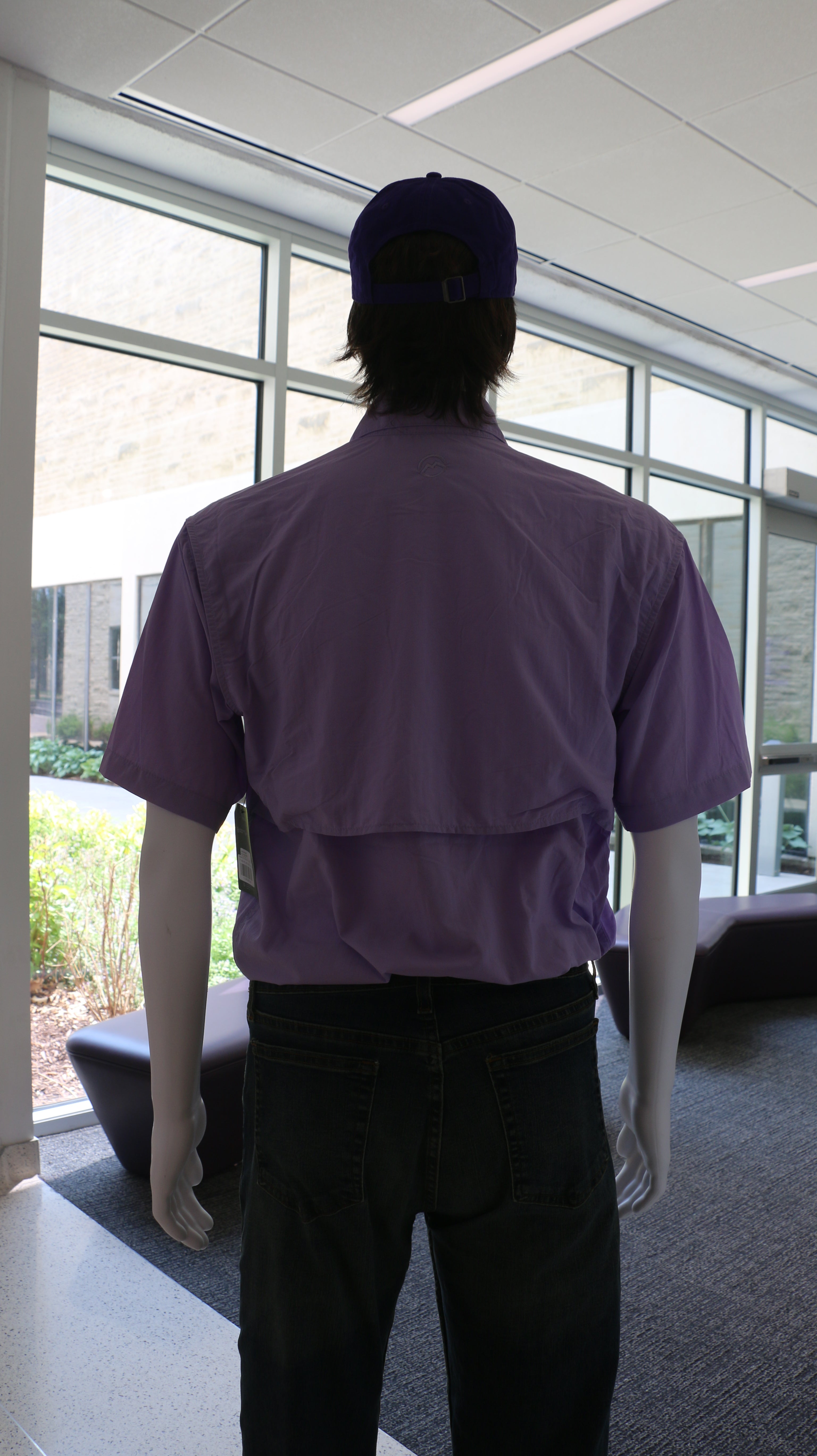 A rear view of the purple rose colored fishing shirt.