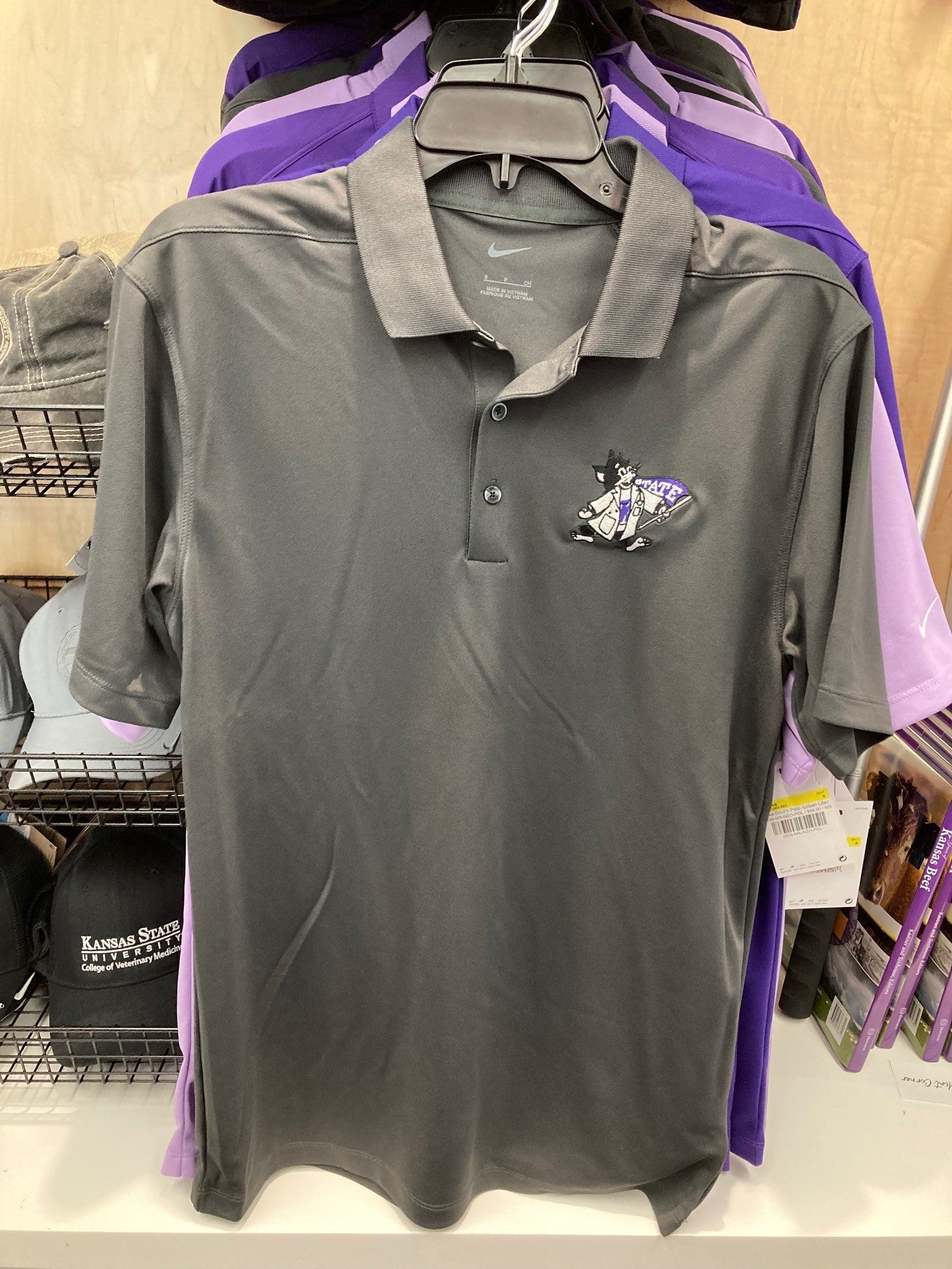 A grey men's Nike polo shirt with a collar, Nike symbol on the left sleeve, and Labcoat Willie on the upper left chest. 
