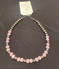 A 16-inch necklace with 8mm Navajo Pearls and Hand Carved Wood Beads in a brown and pink color pattern. 