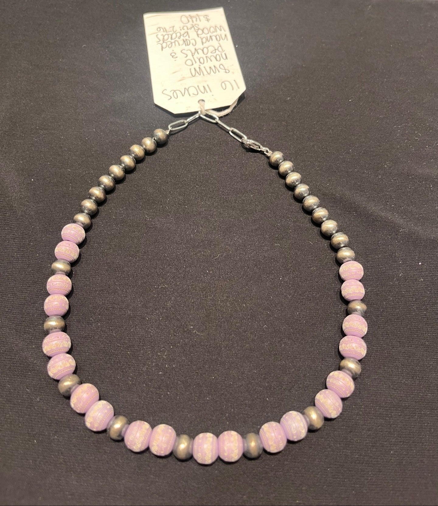 A 16-inch necklace with 8mm Navajo Pearls and Hand Carved Wood Beads in a brown and pink color pattern. 