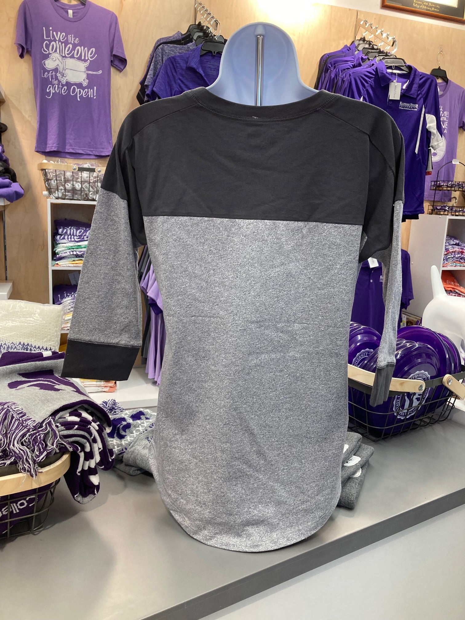 A rear view of the plain 
new era ladies baseball tee. 