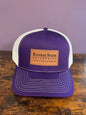 Purple and white trucker hat with Kansas State University wordmark logo on leather patch. 