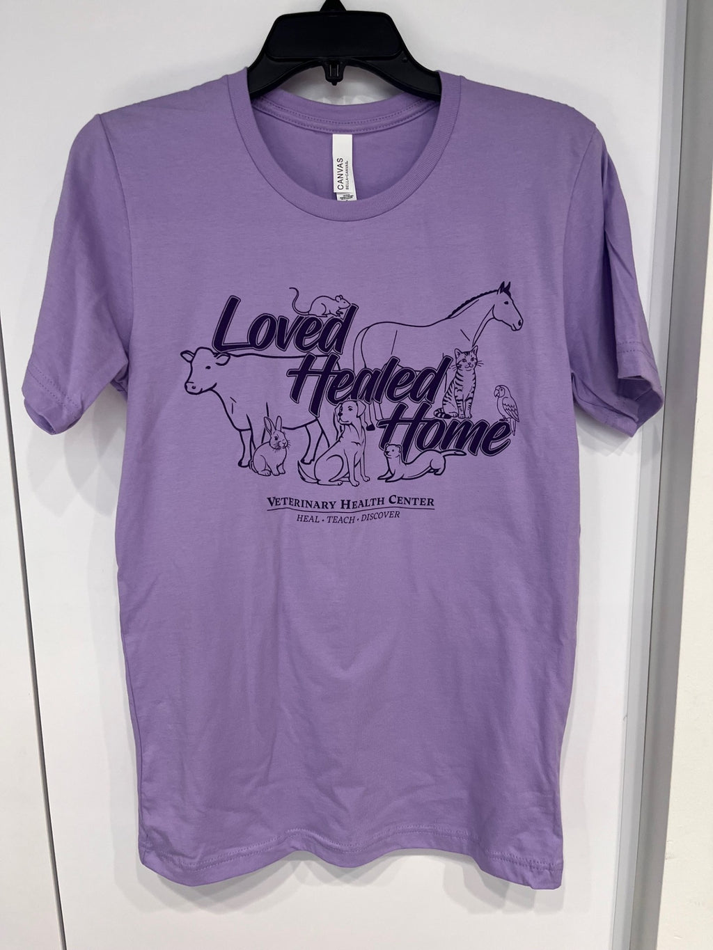 Purple t-shirt with animal illustrations and text on a white background