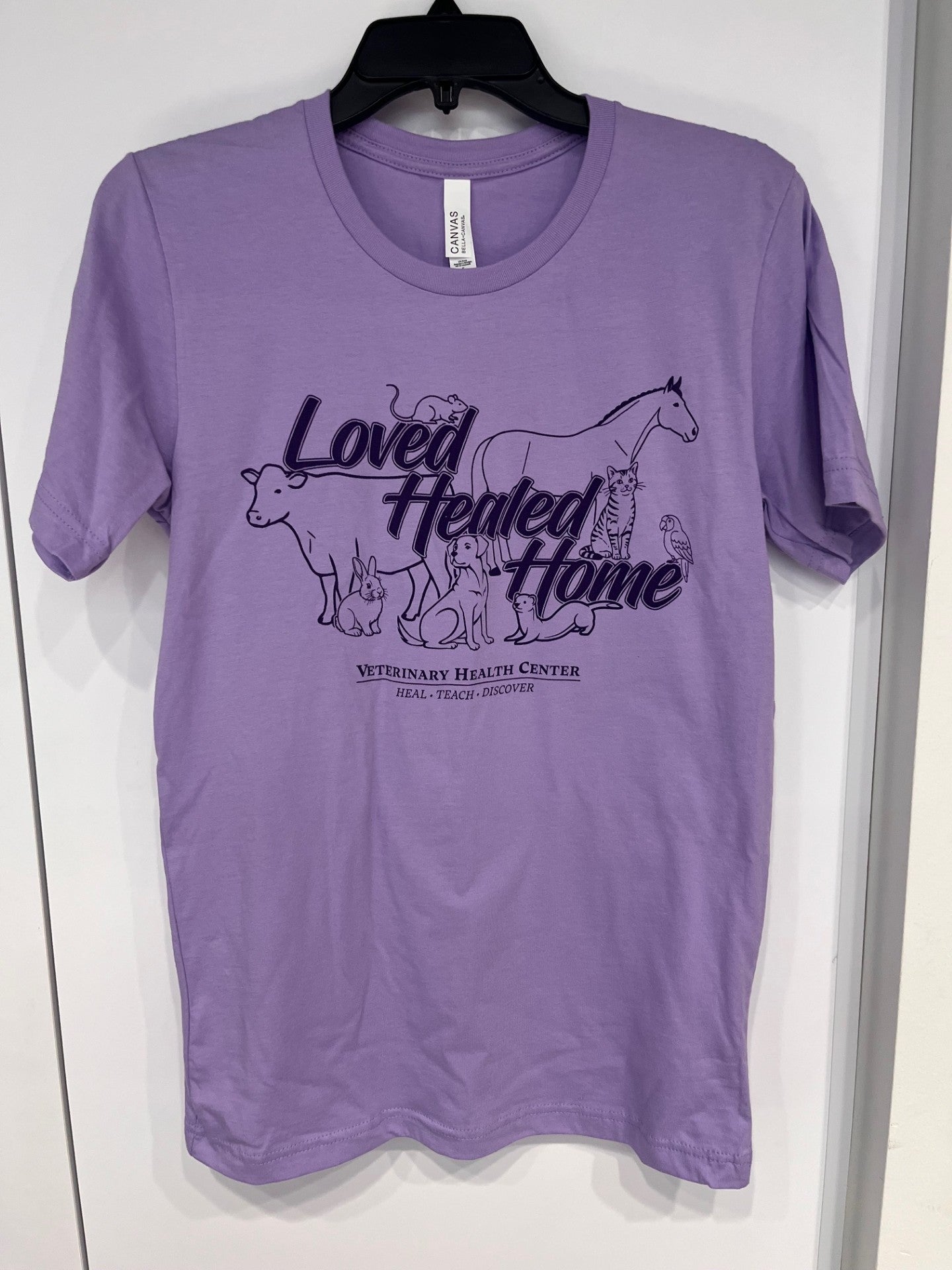 Purple t-shirt with animal illustrations and text on a white background
