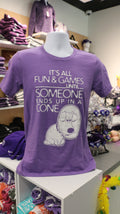 A purple Bella Canvas t-shirt with white text reading "It's all fun & games until SOMEONE ends up in a CONE" with a dog in a cone graphic design on it, displayed on a mannequin.