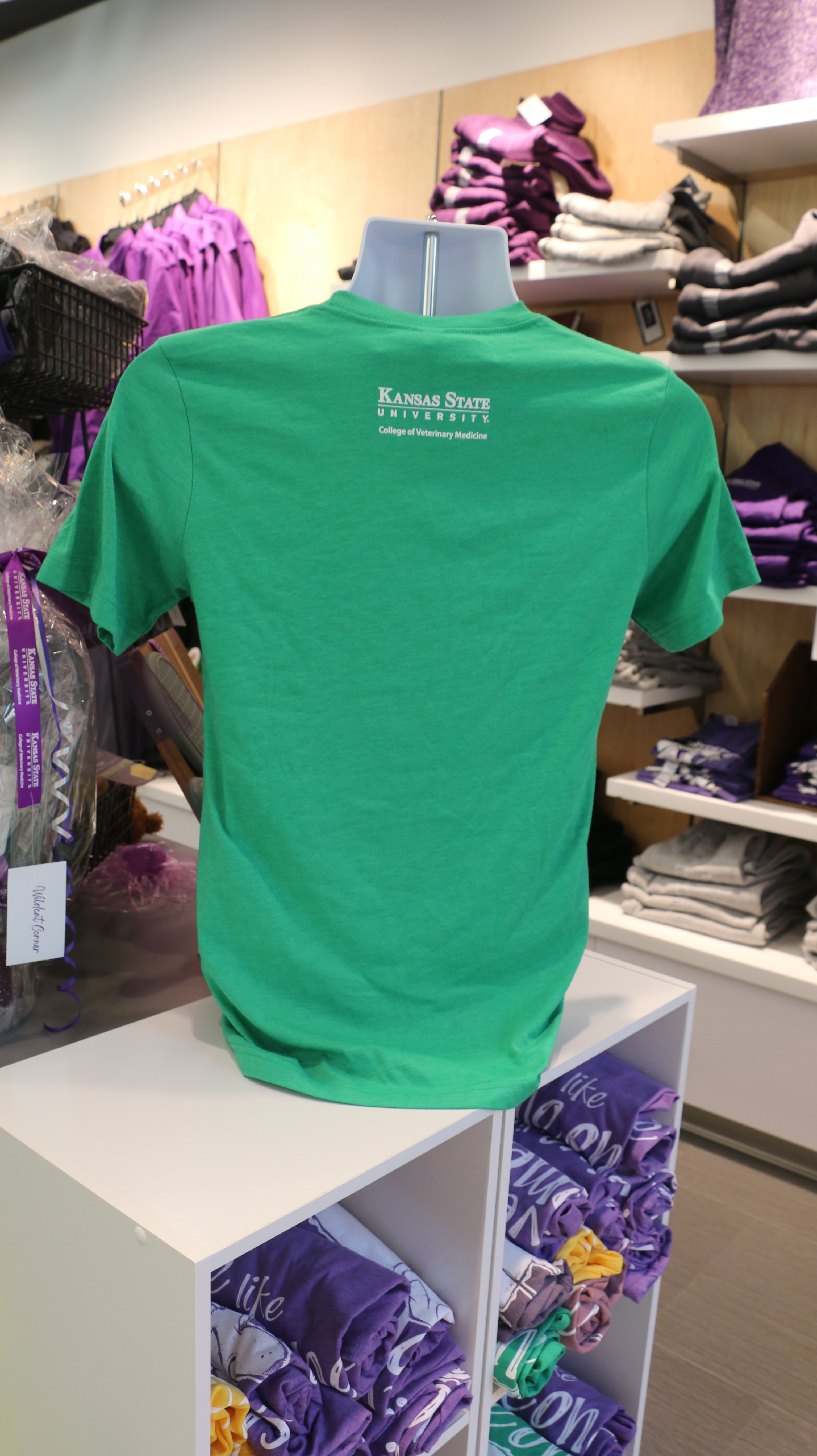 A rear view of the bella canvas gate tshirt with a white CVM logo in the upper middle back area. 