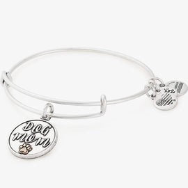 A silver-colored bangle bracelet featuring a "dog mom" charm.