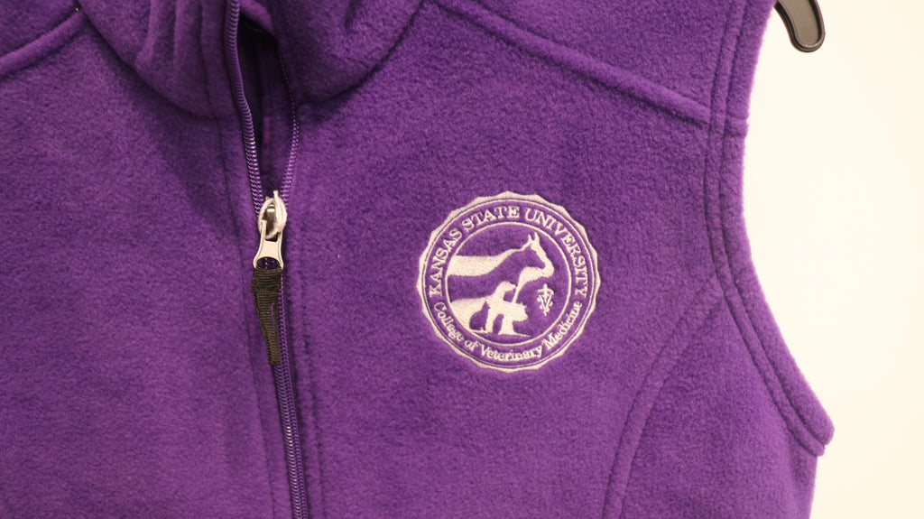 A close-up of the white CVM seal on the upper left chest area. 