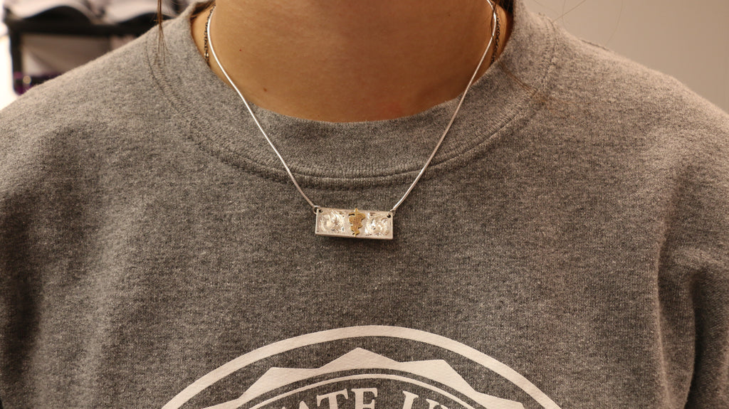 A Custom Silver Caduceus Necklace