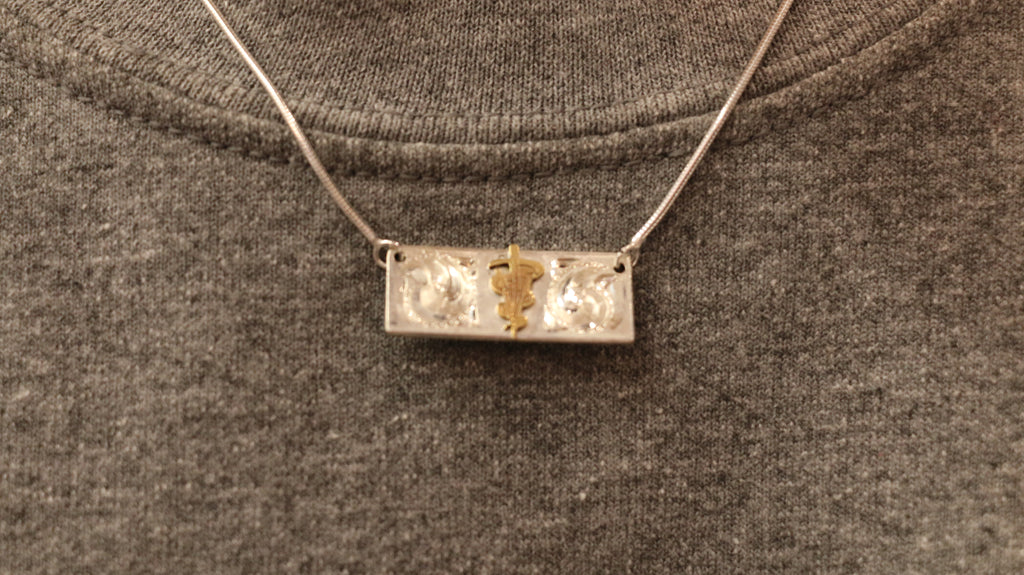 A Custom Silver Caduceus Necklace