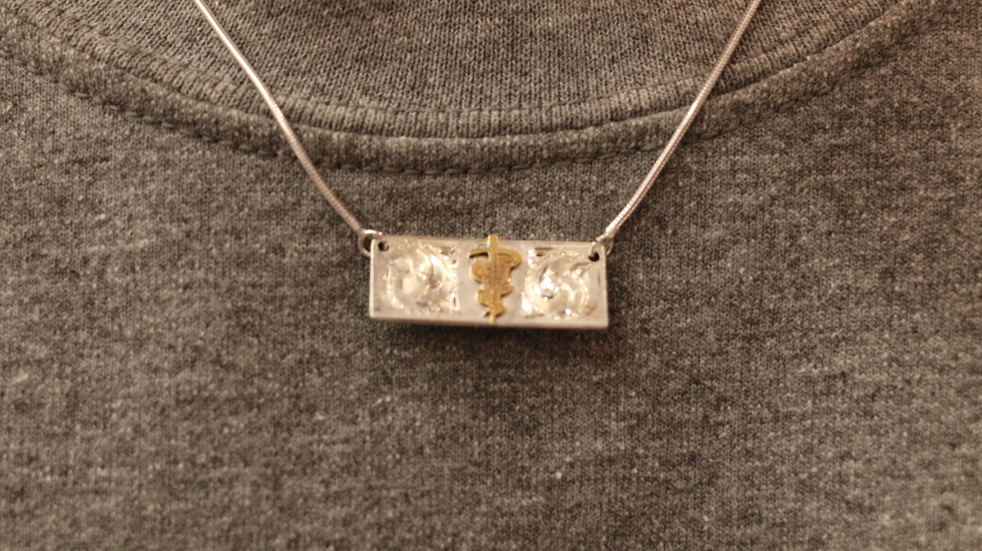 A Custom Silver Caduceus Necklace