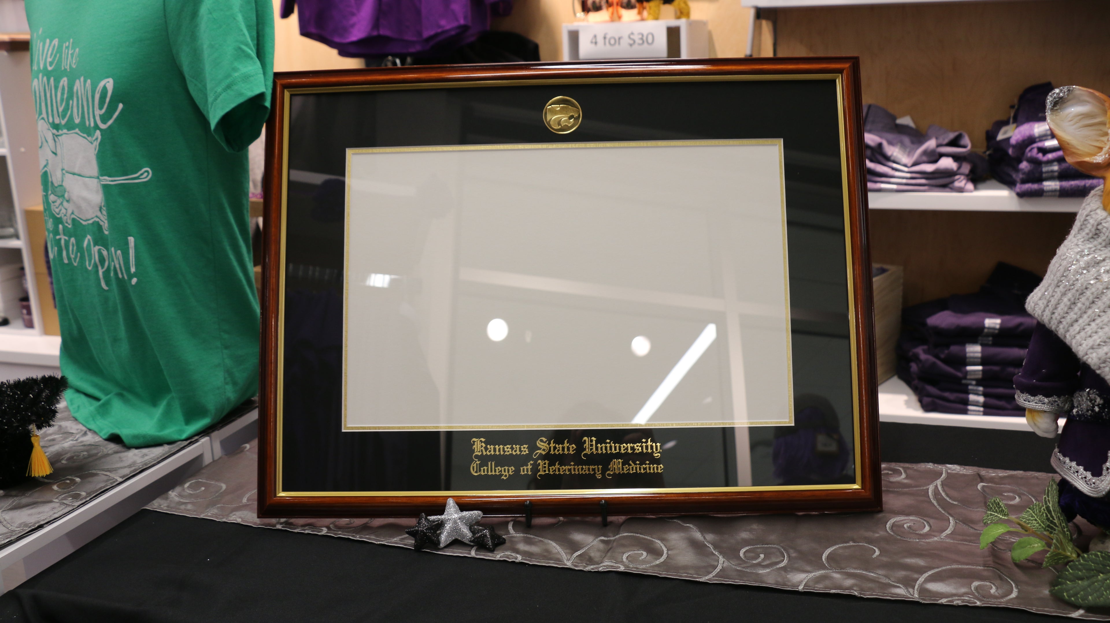 A Walnut with Gold Trim diploma Frame with black primary mat and gold accent, Kansas State University College of Veterinary Medicine gold imprint and 22kt Gold Plated Power Cat logo. Fits 11"H x 17"W diploma.