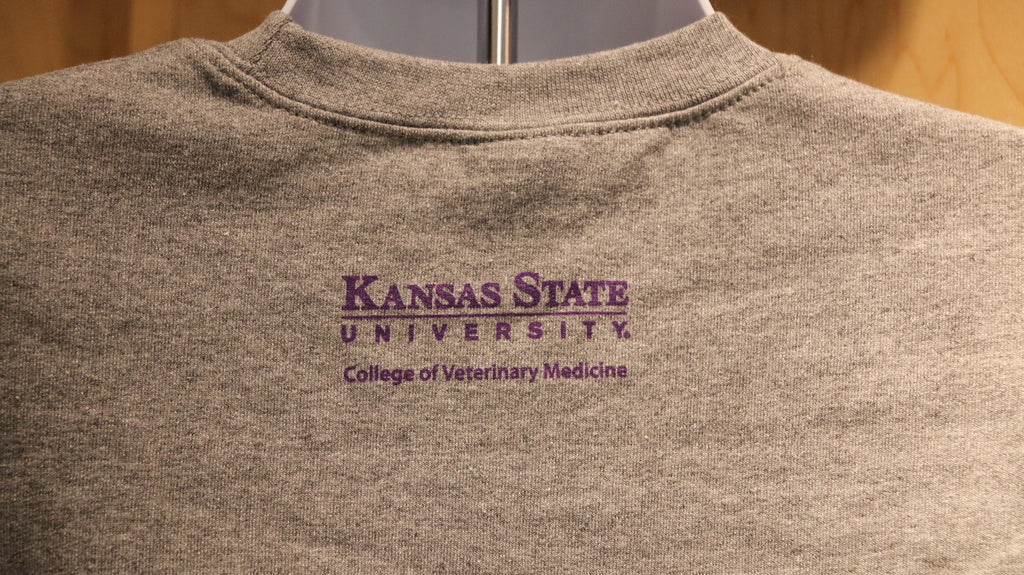 A rear view of the purple CVM logo on the upper middle back area. 