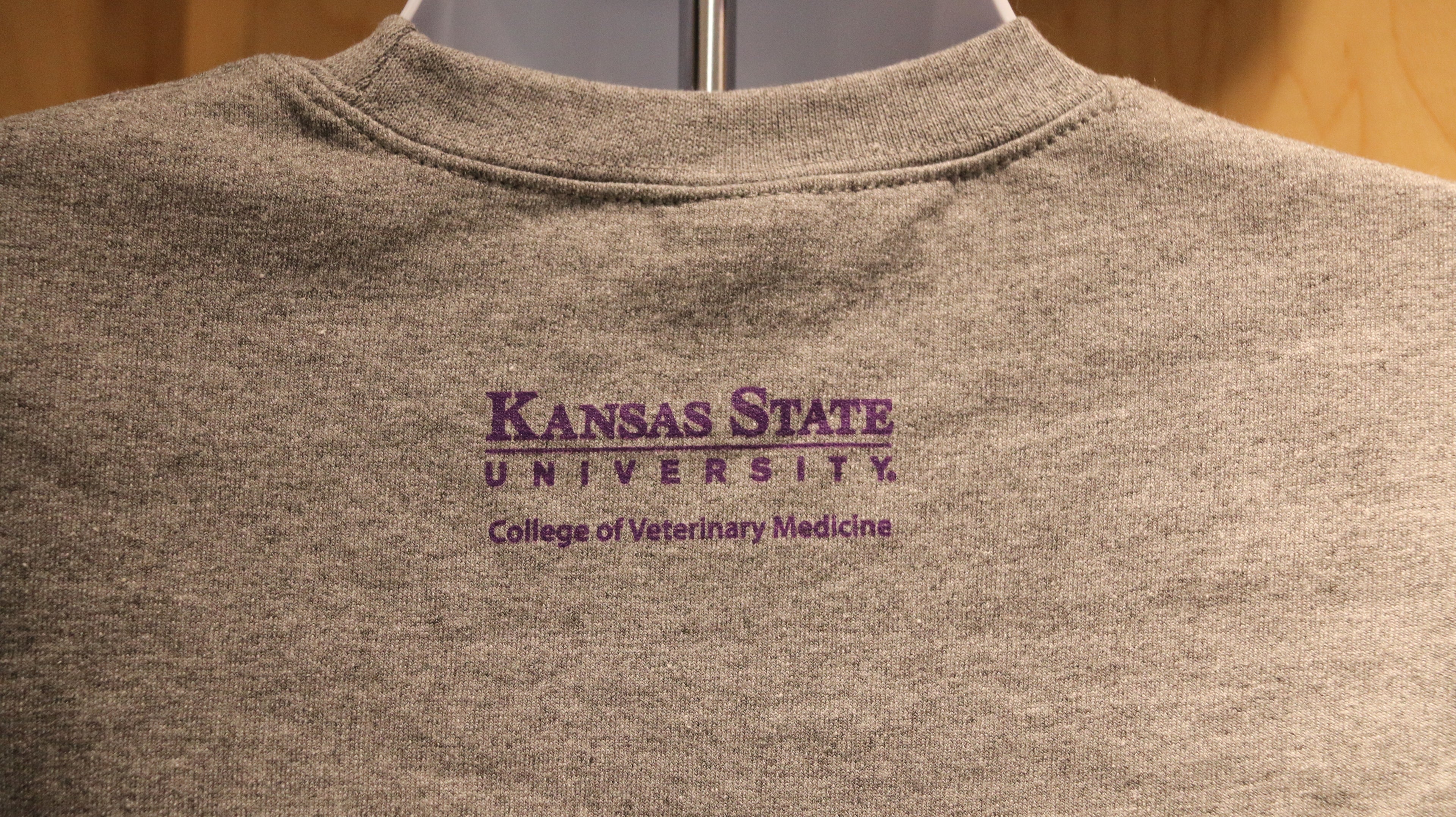 A rear view of the purple CVM logo on the upper middle back area. 