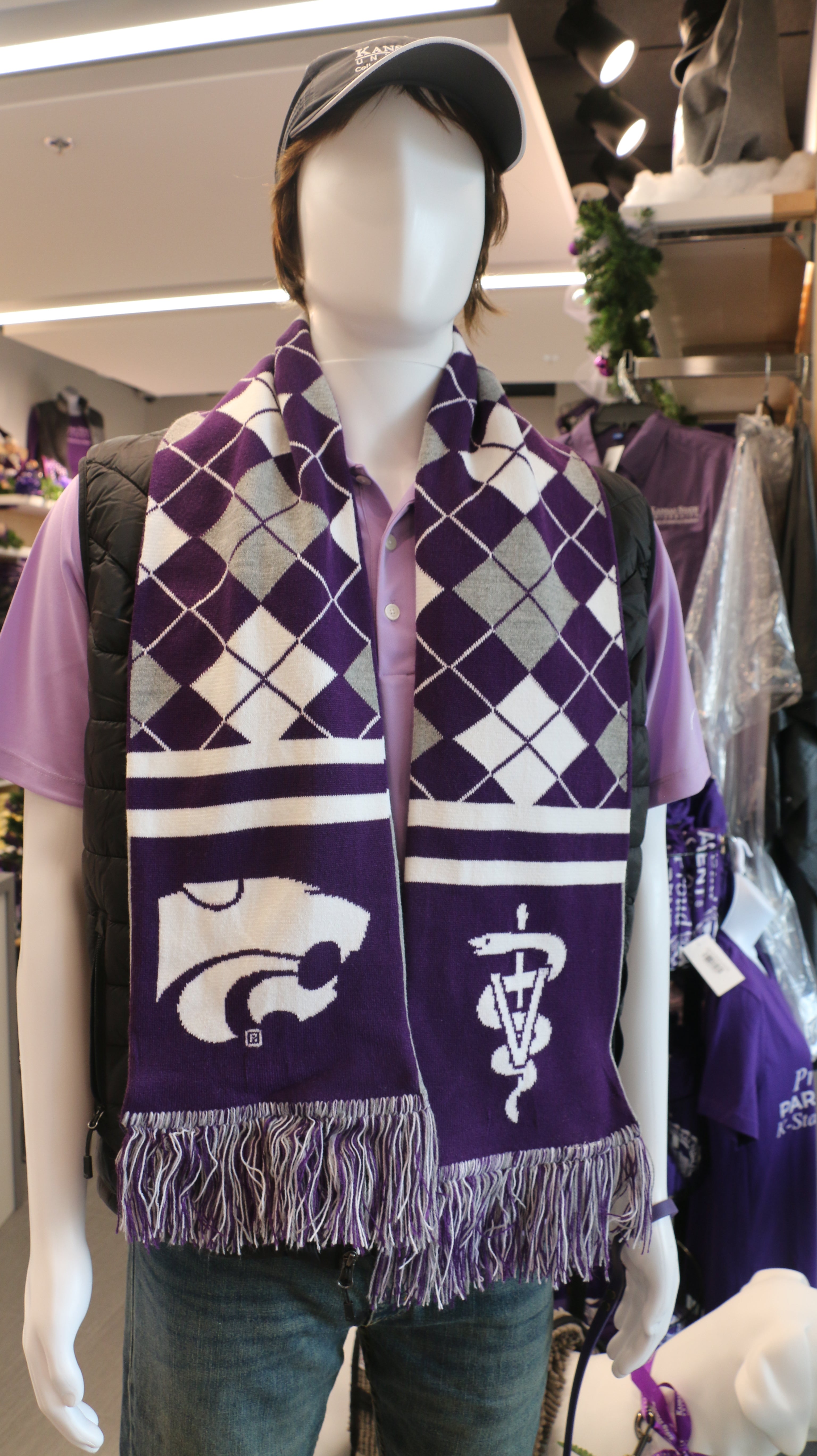 A purple knit scarf with white and purple geometric patterns, K-State CVM logo.