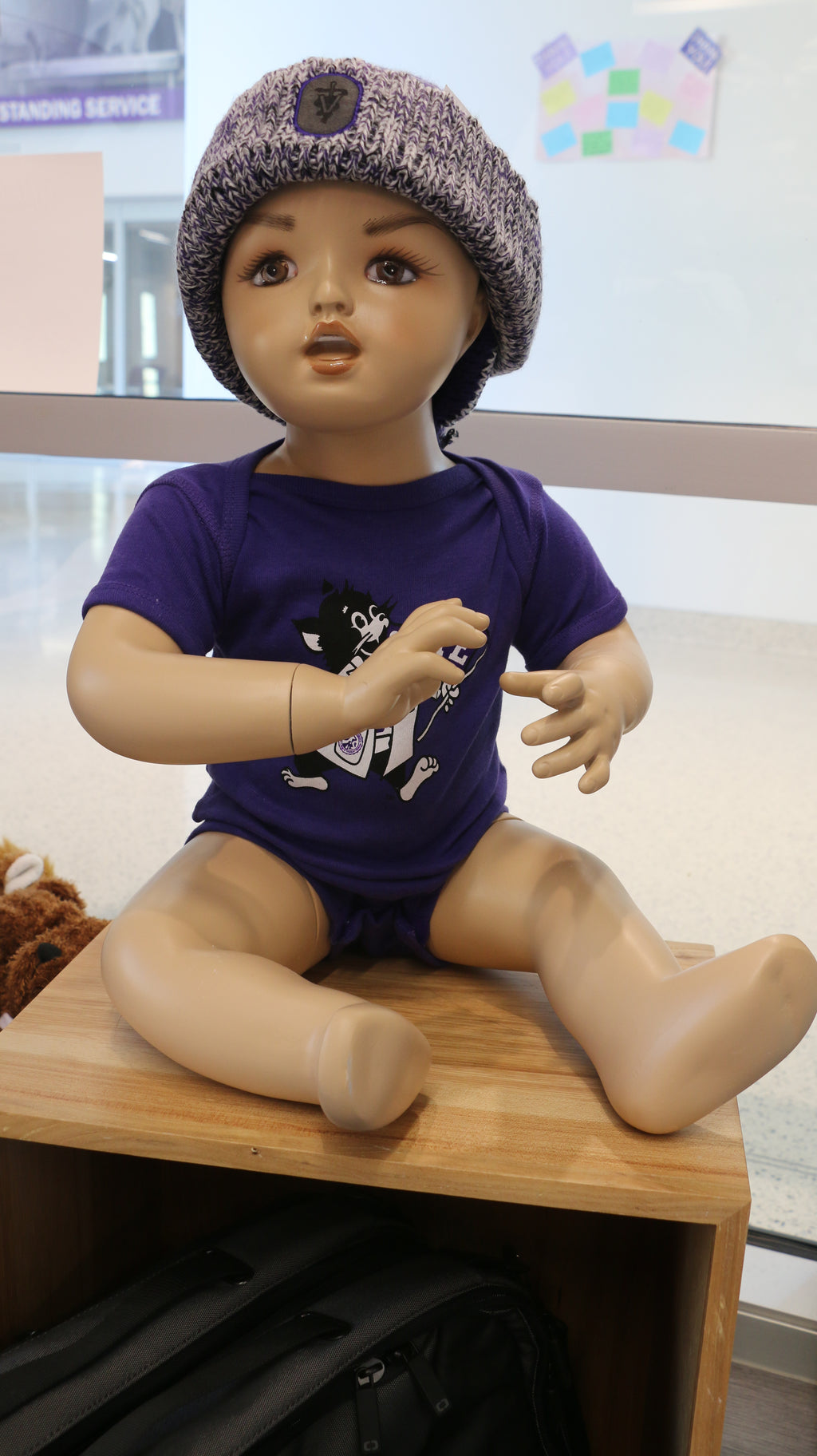 An infant short sleeve onesie with a graphic print of Labcoat Willie, displayed on a baby mannequin.
