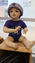An infant short sleeve onesie with a graphic print of Labcoat Willie, displayed on a baby mannequin.