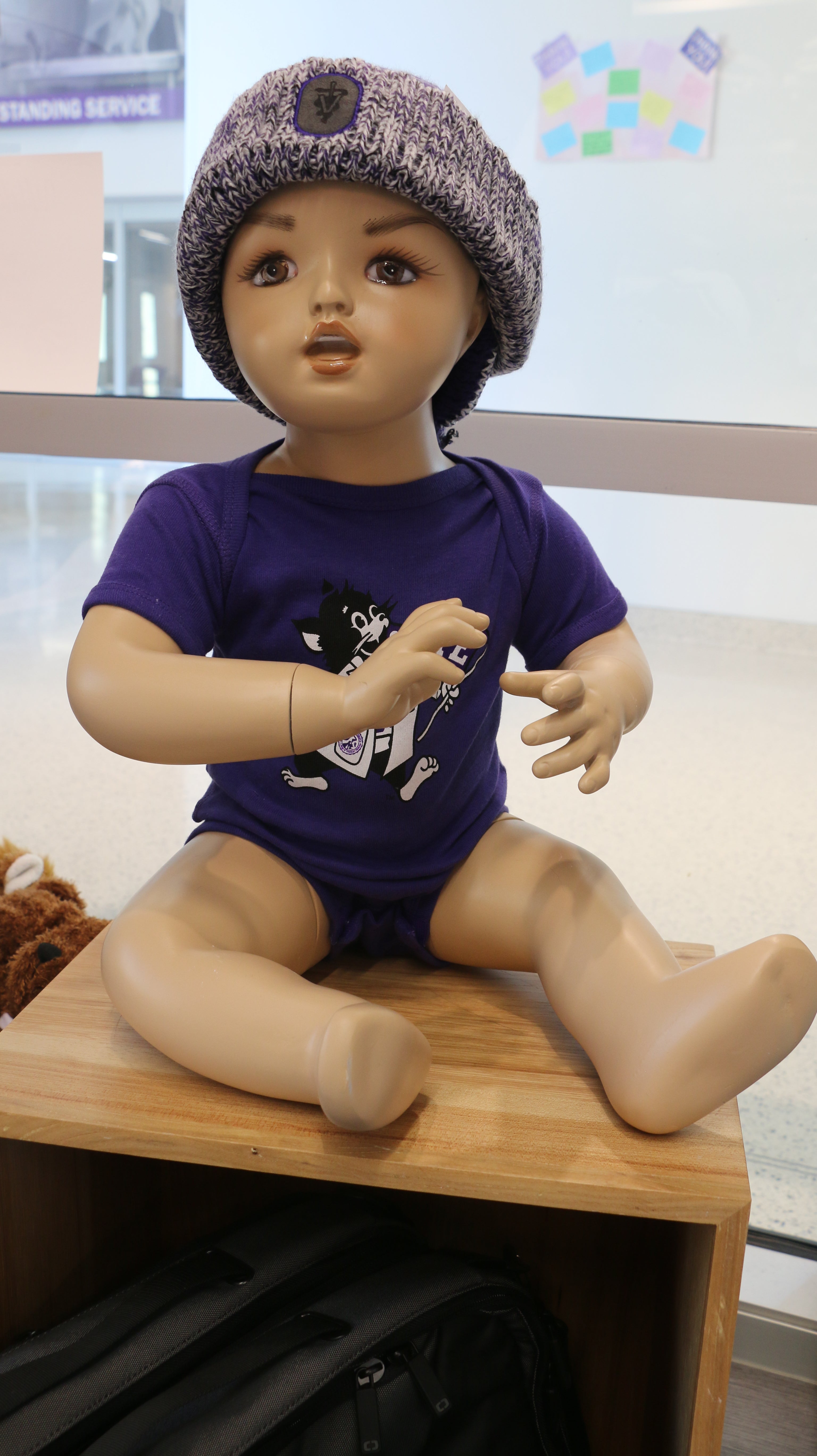 An infant short sleeve onesie with a graphic print of Labcoat Willie, displayed on a baby mannequin.