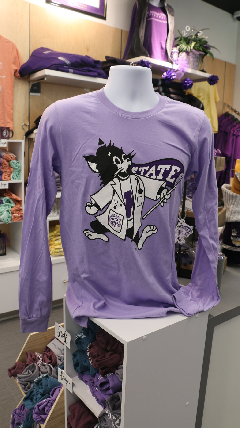A long sleeve dark lavender shirt with Labcoat Willie in the center. 