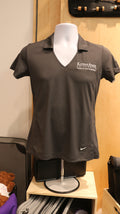 A gray Nike Golf Dri-Fit Mesh Polo shirt with white embroidery on a mannequin. 
