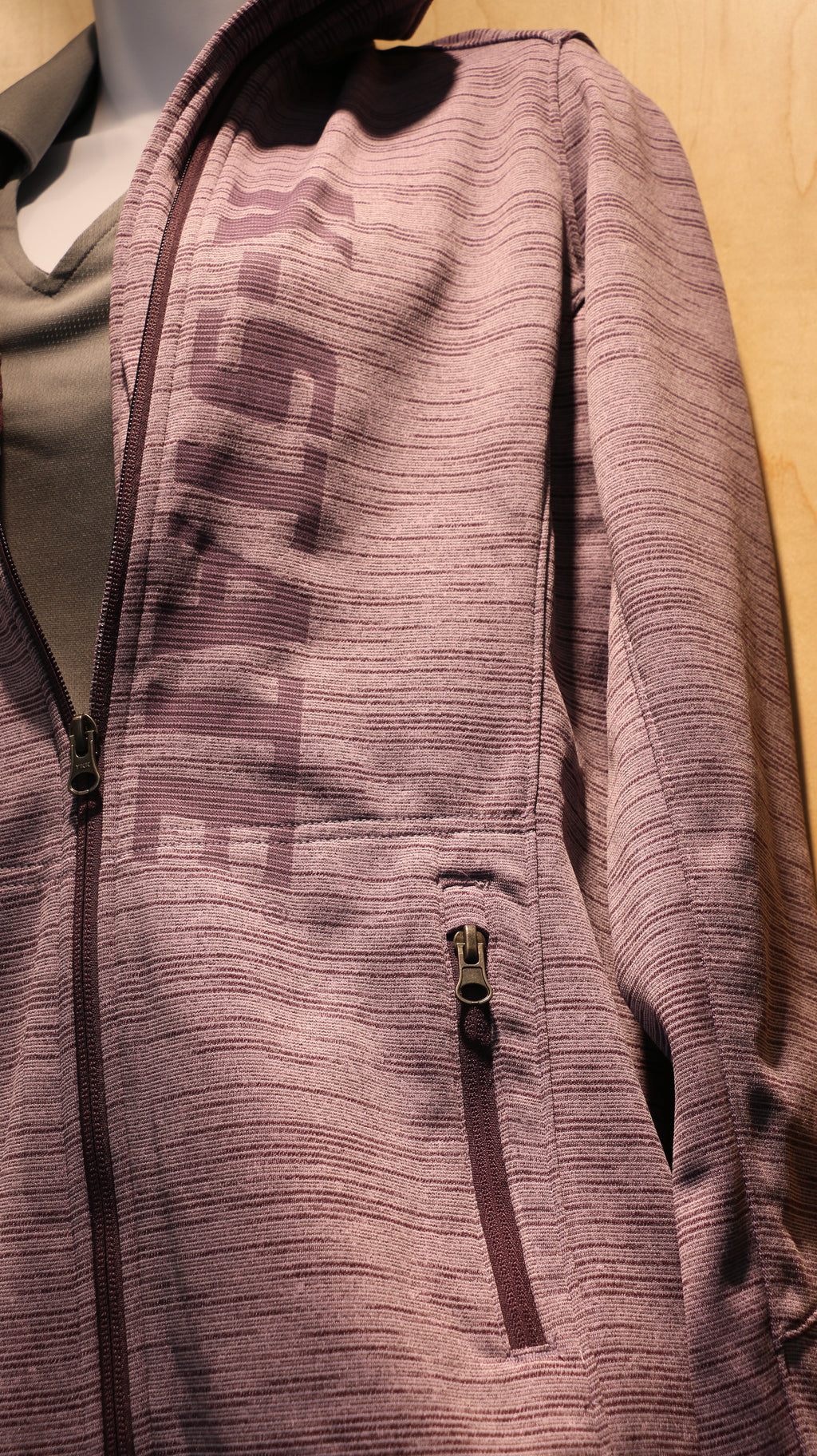 A close-up view of the K-State laser etched down the front of the fleece. 
