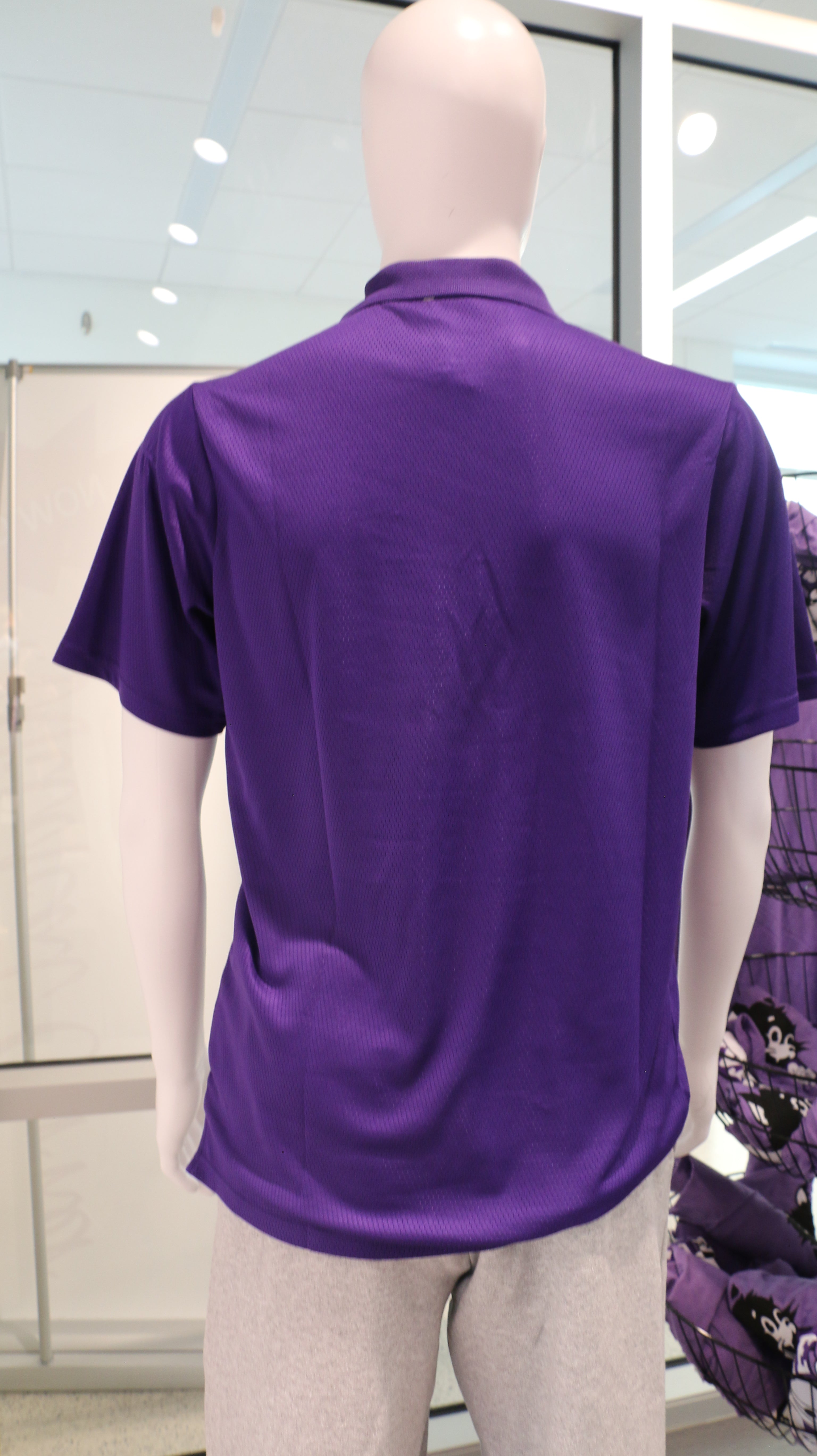 A rear view of the purple men's Holloway Prism polo shirt. 