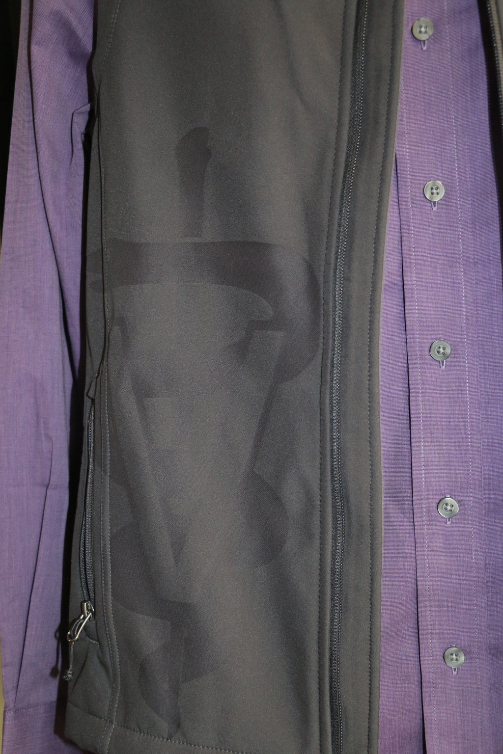 A close-up view of the lasered on the bottom right side of the vest.