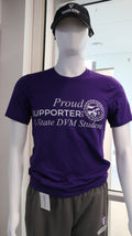 A purple Bella canvas T-shirt displayed on a mannequin, with the text 'PROUD SUPPORTER OF A K-STATE DVM STUDENT' printed on the front.
