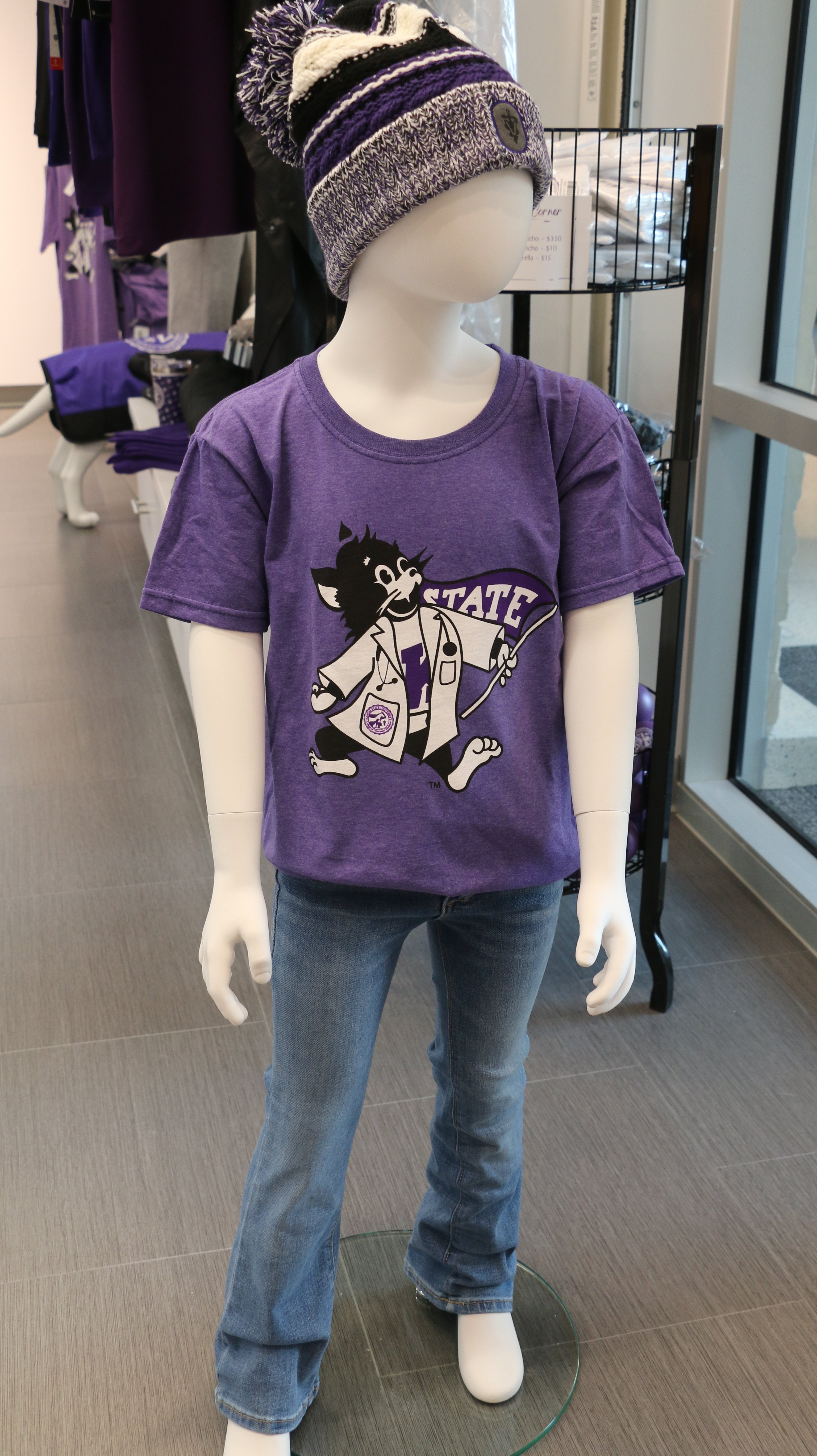 A heather purple Fruit of The Loom youth t-shirt displayed on a mannequin, paired with jeans and a matching purple hat.