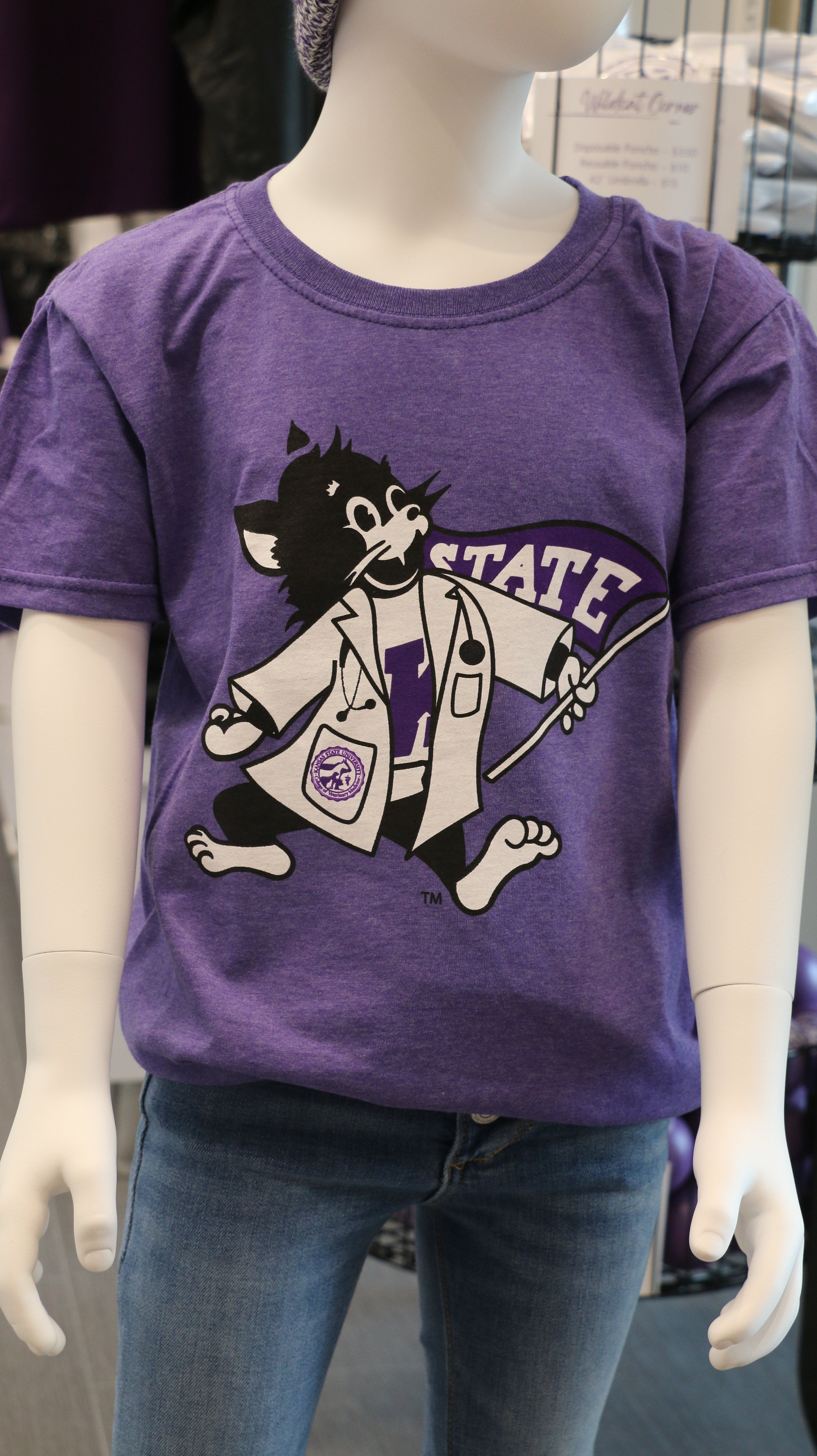 A heather purple Fruit of The Loom youth t-shirt displayed on a mannequin, paired with jeans and a matching purple hat.