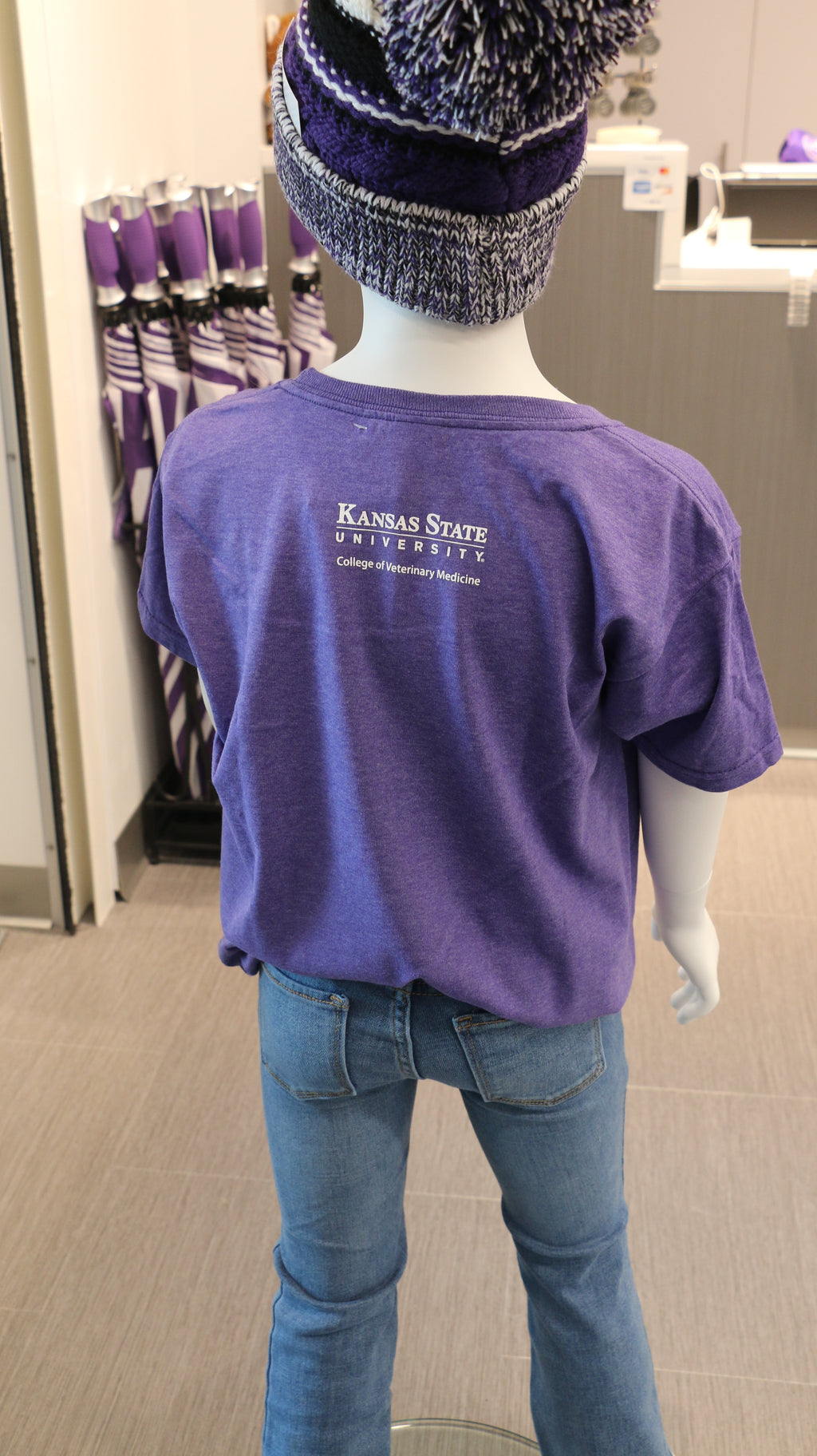 A rear view of the white CVM logo on the upper middle back area. 